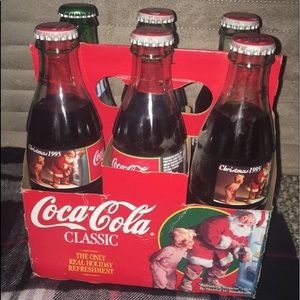 Coco cola bottles and 1 sprite bottle